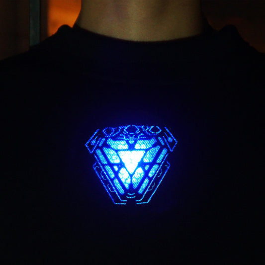 Triangular blue arc reactor pattern framed by details through a dark shirt